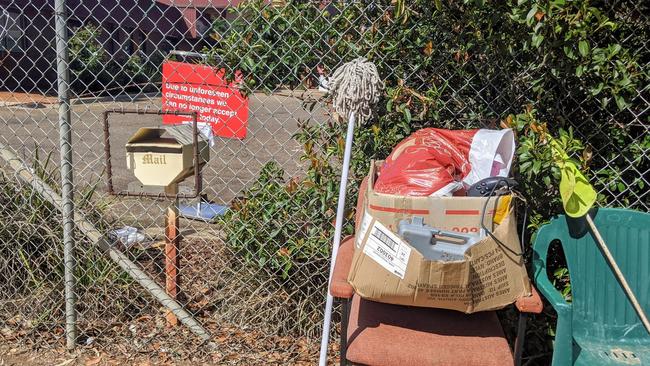 Goods left outside the front gate of the Wagga Salvation Army Family Store after it closed its gates due to COVID-19. Picture: Toby Vue