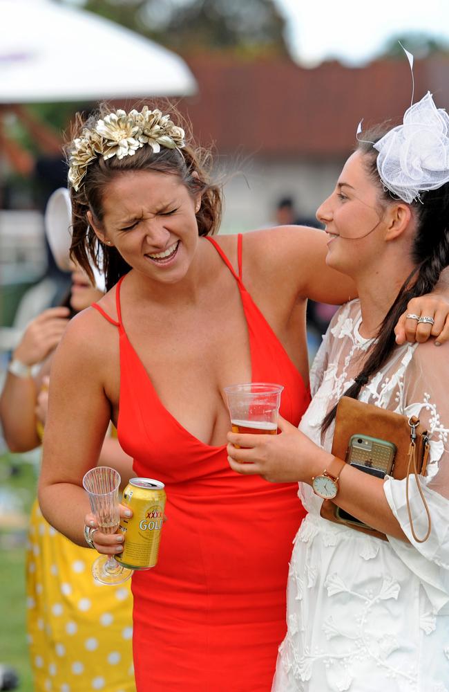 Punters enjoying themselves after the running of the Melbourne Cup, at Flemington Racecourse.