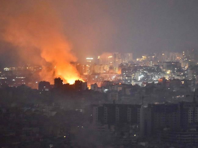 Flames and smoke rise in an area targeted by an Israeli air strike on Beirut's southern suburbs, October 6. Picture: AFP