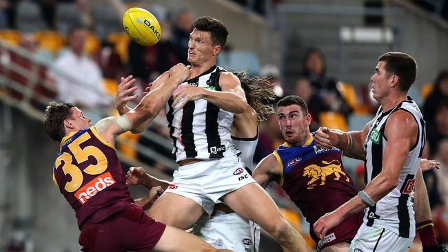 Brody Mihocek flies for a mark against Brisbane. Picture: Jono Searle/AFL Photos/via Getty Imagesv