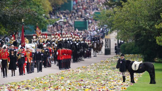 Emma, the monarch's fell pony stands by, as the procession following the coffin of Queen Elizabeth II, aboard the state hearse, travels up The Long Walk in Windsor on September 19, making its final journey to Windsor Castle. Picture: Andrew Matthews/ POOL/ AFP.