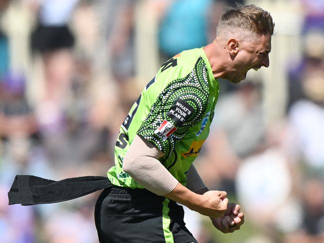 HOBART, AUSTRALIA - JANUARY 15: Daniel Sams of the Thunder celebrates the wicket of Caleb Jewell of the Hurricanes during the Men's Big Bash League match between the Hobart Hurricanes and the Sydney Thunder at Blundstone Arena, on January 15, 2023, in Hobart, Australia. (Photo by Steve Bell/Getty Images)
