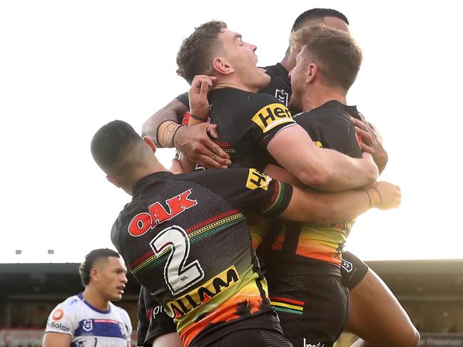 PENRITH, AUSTRALIA - MAY 29: Paul Momirovski of the Panthers celebrates scoring a try with team mates during the round 12 NRL match between the Penrith Panthers and the Canterbury Bulldogs at Panthers Stadium, on May 29, 2021, in Penrith, Australia. (Photo by Brendon Thorne/Getty Images)