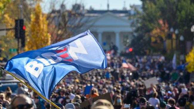 Americans celebrate Joe Biden’s win on Black Lives Matter plaza across from the White House in Washington. Picture: AFP.