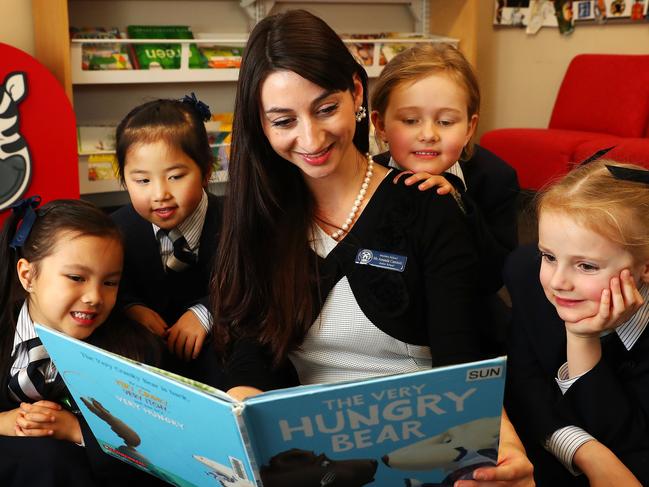 18/8/17: L to R..Meriden Junior school students Estella Yan, Camille Lin, teacher Amanda Caminiti, Claire De Lany and Lucinda Buckley reading in the school library. Meriden Junior school in Sydney's west  is big on reading, and phonics.John Feder/The Australian