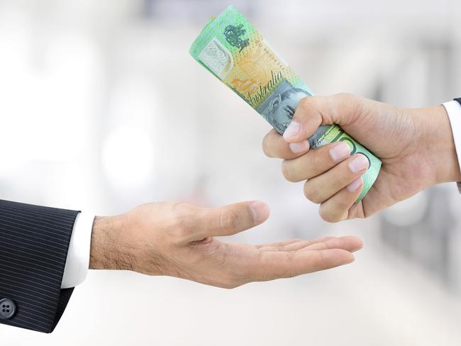 Businessman hands passing money, Australian dollar bills, tax refund generic