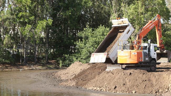 Trucks dumping soil at Black Swan Lake. Picture Glenn Hampson