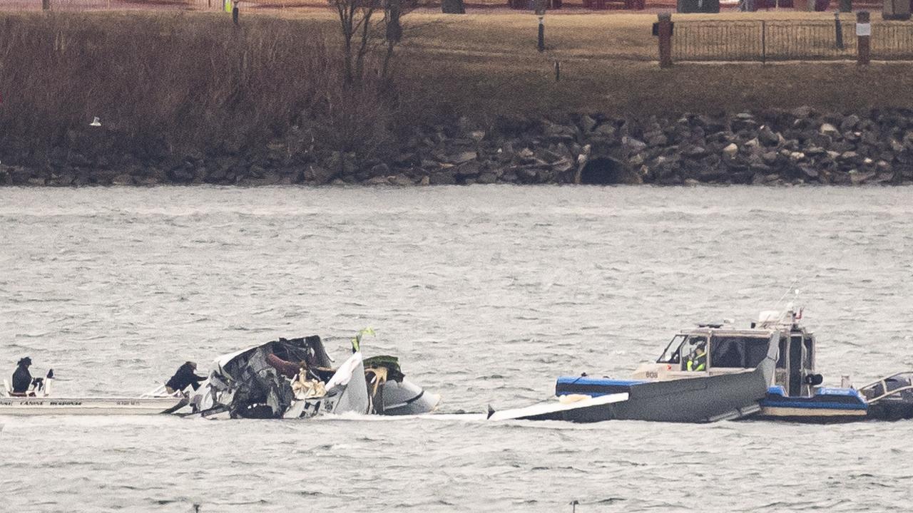 Recovery teams search the wreckage after the crash of an American Airlines plane on the Potomac River. Picture: Al Drago/Getty Images North America via AFP