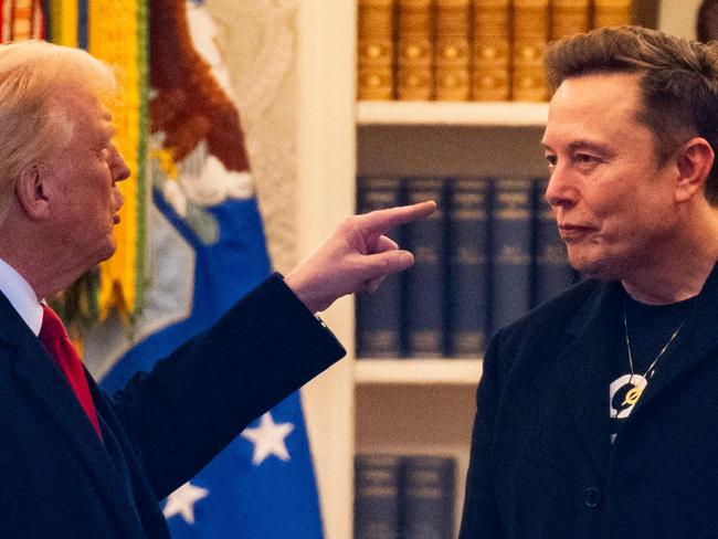 TOPSHOT - US President Donald Trump and Elon Musk (R) speak before departing the White House on his way to his South Florida home in Mar-a-Lago in Florida on March 14, 2025. Trump is spending the weekend at his Florida Mar-a-Lago resort. (Photo by ROBERTO SCHMIDT / AFP)