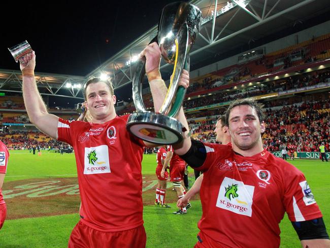 James Horwill and Ben Daley show off the Super Rugby trophy after the Reds won the 2011 competition.