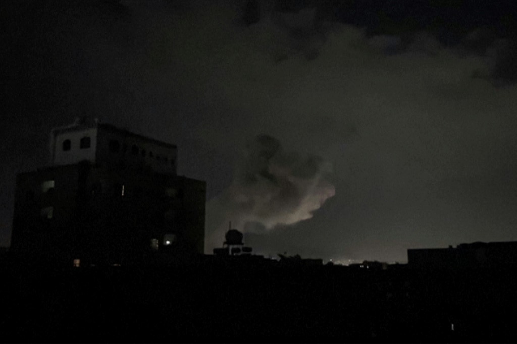 This image from AFPTV footage shows smoke rising following bombardment on Yemen's Huthi-controlled capital Sanaa on March 15, 2025