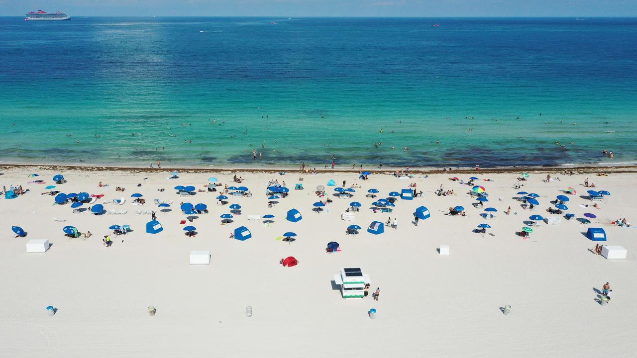 Beachgoers take advantage of the opening of South Beach in Miami last weekend. Picture: Getty Images