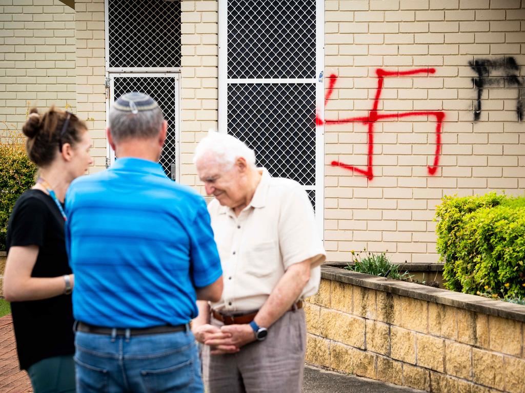 Synagogue President George Foster with members of the community outside the vandalised synagogue in Alawah. Photo: Tom Parrish