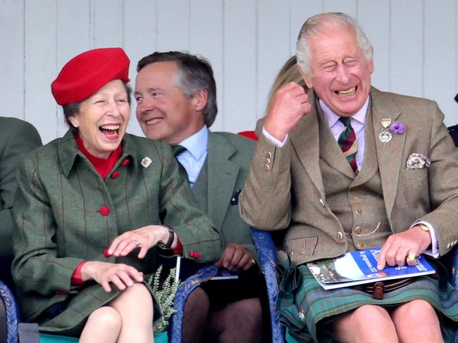 BRAEMAR, SCOTLAND - SEPTEMBER 03: Anne, Princess Royal and Prince Charles, Prince of Wales, known as the Duke of Rothesay when in Scotland laughing during the Braemar Highland Gathering at the Princess Royal & Duke of Fife Memorial Park on September 03, 2022 in Braemar, Scotland. The Braemar Gathering is the most famous of the Highland Games and is known worldwide. Each year thousands of visitors descend on this small Scottish village on the first Saturday in September to watch one of the more colourful Scottish traditions. The Gathering has a long history and in its modern form it stretches back nearly 200 years. The Queen Elizabeth Platinum Jubilee Archway was designed by architect Keith Ross, erected to celebrate 70 years of Her Majesty as monarch and as Patron of The Braemar Royal Highland Society, organiser of the annual Braemar Gathering. (Photo by Chris Jackson/Getty Images)