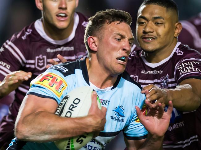 Kurt Capewell of the Sharks is tackled during the First NRL Elimination Final between the Manly Sea Eagles and the Cronulla Sharks at Lottoland in Sydney, Saturday, September 14, 2019. (AAP Image/Craig Golding) NO ARCHIVING, EDITORIAL USE ONLY