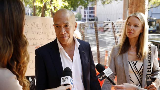 Dr Teo and his fiance Traci Griffiths have arrived hand-in-hand each day. Picture: Tim Hunter.