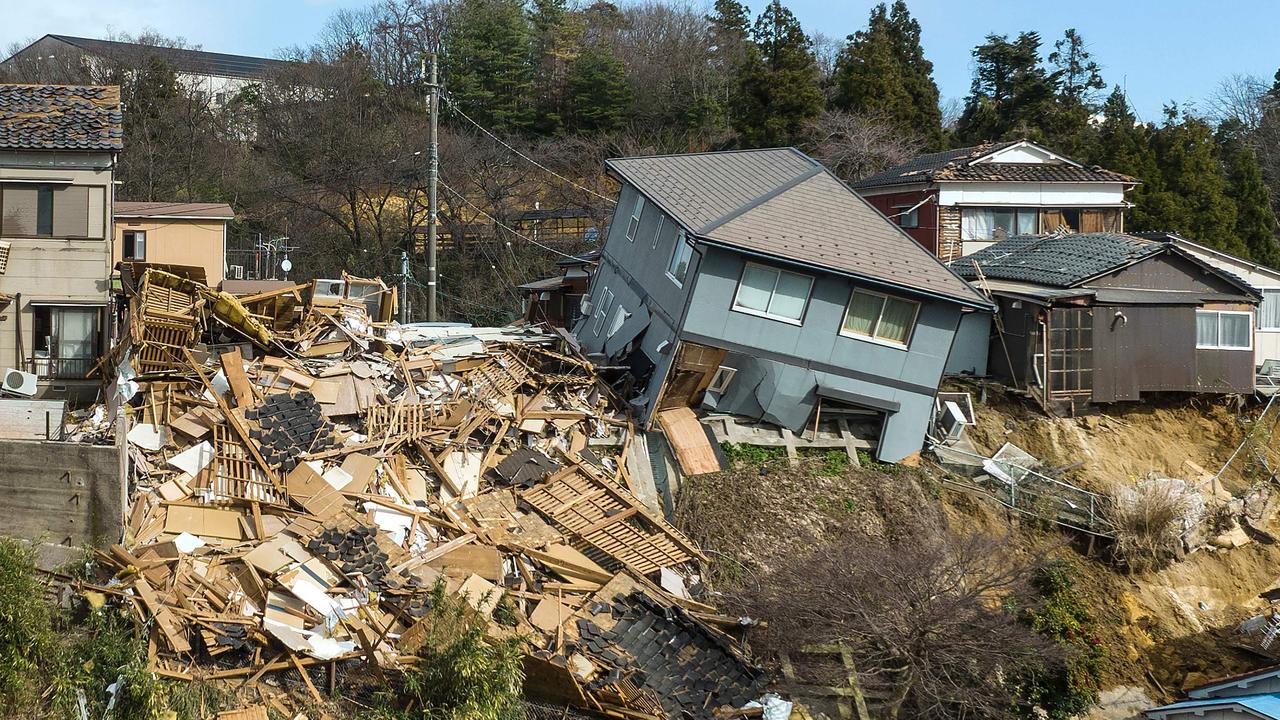 Damaged houses, including one totally collapsed (C), are pictured along a street in Wajima, Ishikawa prefecture on January 2, 2024, a day after a major 7.5 magnitude earthquake struck the Noto region in Ishikawa prefecture. Picture: Fred MERY / AFP