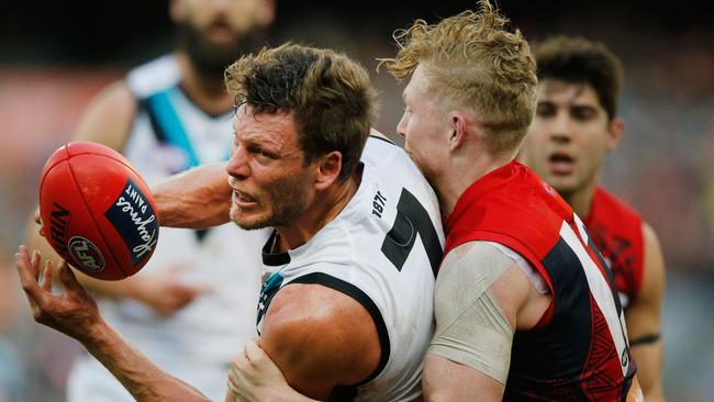 Clayton Oliver of the Demons tackles Brad Ebert of the Power. Picture: Michael Dodge/Getty Images