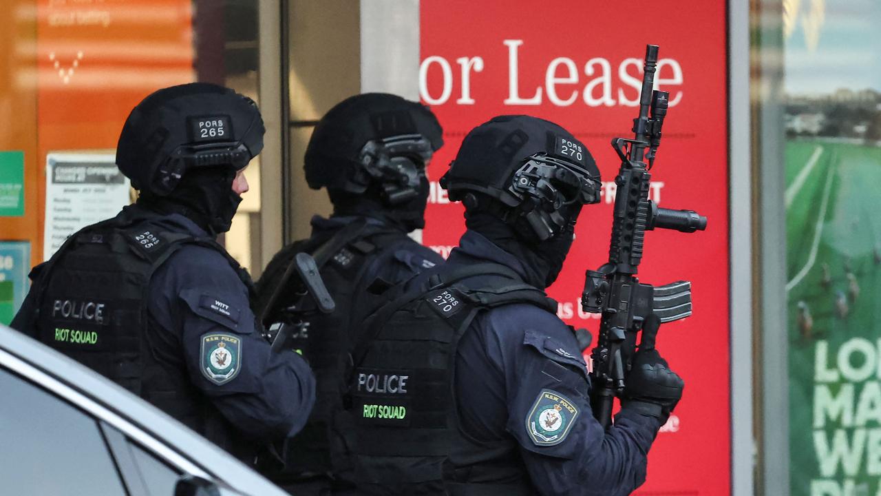 Tactical police are seen at Westfield as the horror unfolded. (Photo by David GRAY / AFP)