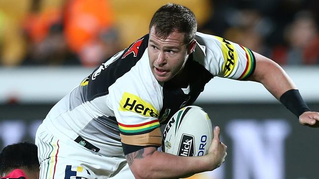 Trent Merrin of the Panthers is tackled.