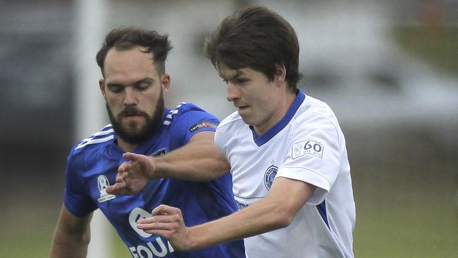 Blue Eagles’ Hamish McCabe under pressure from Comet's Andreas Wiens last year (AAP Image/Dean Martin)