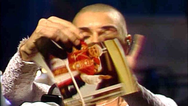 Irish singer Sinead O'Connor tearing up a picture of the Pope on Saturday Night Live.