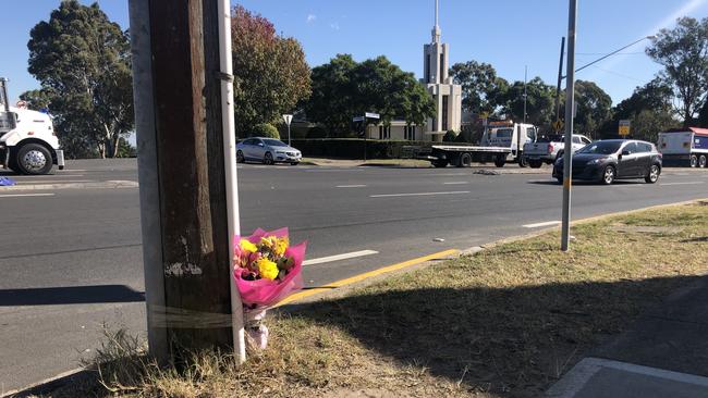 Flowers left on the side of the road near the crash site. Picture: Gary Hamilton-Irvine