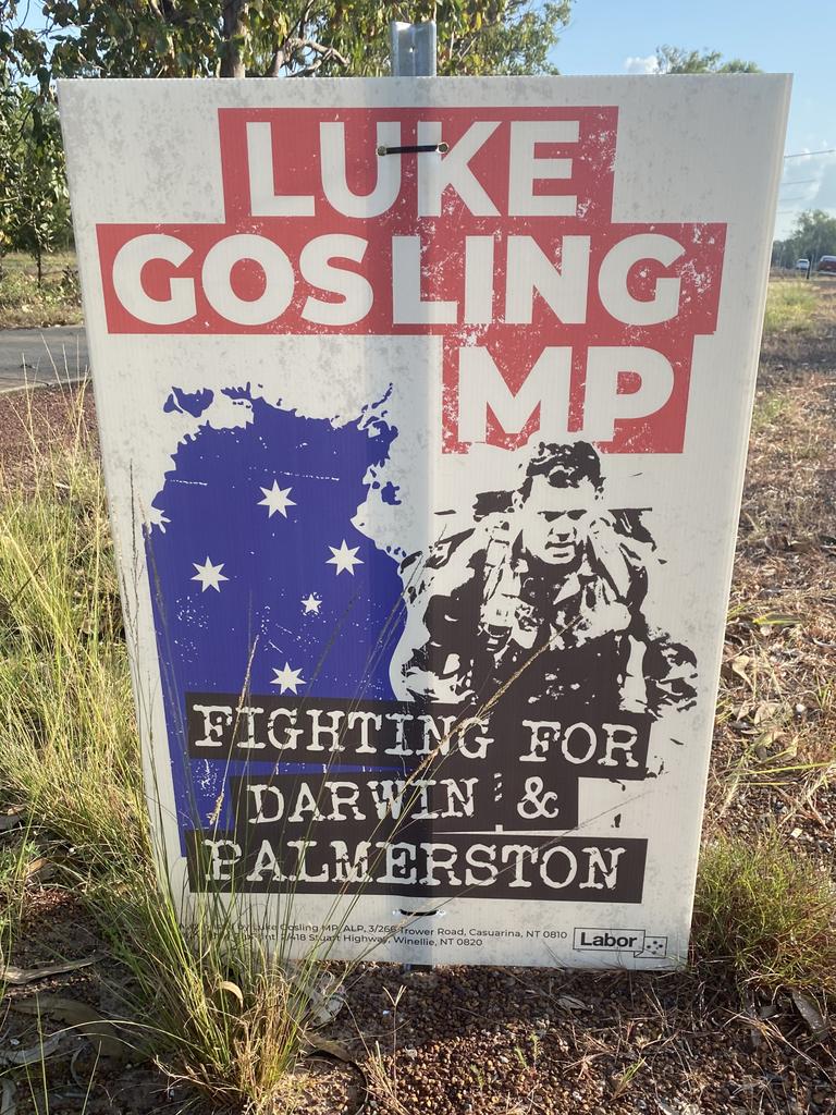 Luke Gosling's corflute displays a picture of him in military gear.