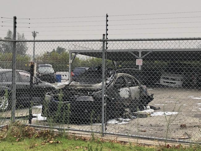 The burnt out Holden Commodore in the Albion Park holding facility. Picture: Madeline Crittenden. 