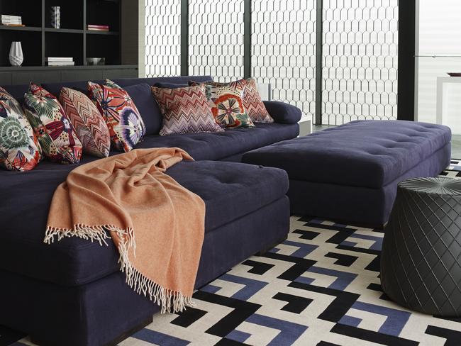 The geometric rug and Missoni cushions tie this scheme together.