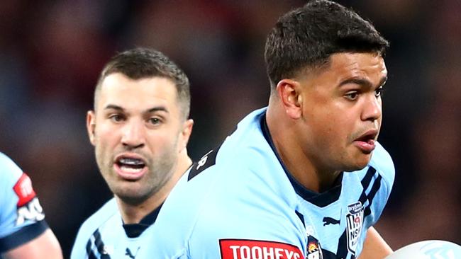 BRISBANE, AUSTRALIA - JUNE 27: Latrell Mitchell of the Blues makes a break during game two of the 2021 State of Origin series between the Queensland Maroons and the New South Wales Blues at Suncorp Stadium on June 27, 2021 in Brisbane, Australia. (Photo by Chris Hyde/Getty Images)