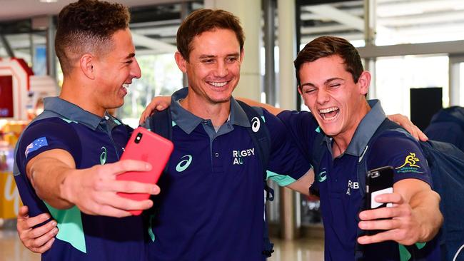 The Junior Wallabies arrive at Sydney International Airport after finishing second in the World Rugby U20s Championship in Argentina. Mark Nawaqanitawase, Rugby Australia national coaching advisor Stephen Larkham and Henry Robertson (right). Picture: Rugby AU Media