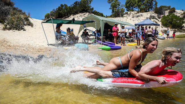 Chelsea Haddad and Bailey Stevens celebrate Australia Day at Moore River in WA. Picture: Colin Murty