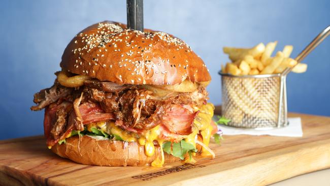 The 1.8kg Phat Bastard burger at Longboards Laidback Eatery and Bar in Surfers Paradise. Pic by Luke Marsden.