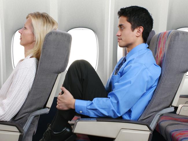 squashed person on airplane no room