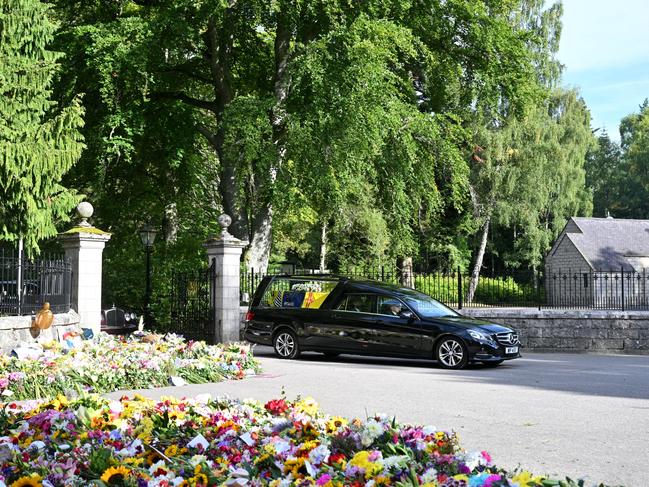 The Queen’s funeral cortege is seen leaving Balmoral Castle. Picture: WireImage.