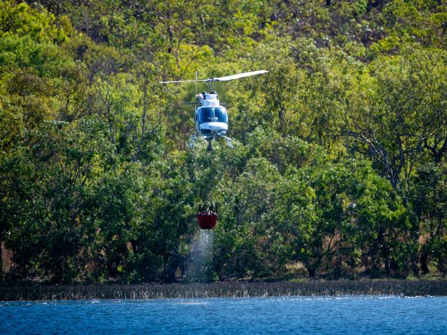 A bushfire threatens homes and properties in the idyllic Lake Bennett region in late August. Multiple helicopters and volunteer fire fighting units battled the blaze for two days. Pictured is a helicopter getting water to attack the fires directly from Lake Bennett. Picture: Che Chorley