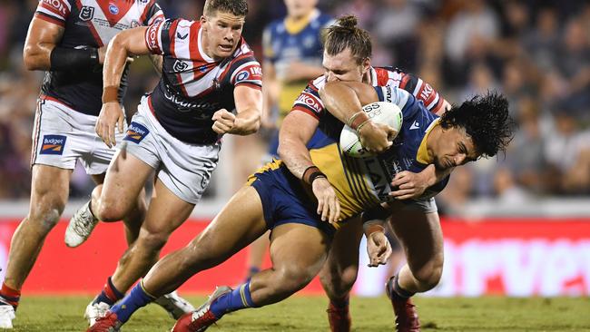 MACKAY, AUSTRALIA – JULY 29: Oregon Kaufusi of the Eels is tackled during the round 20 NRL match between the Sydney Roosters and the Parramatta Eels at BB Print Stadium, on July 29, 2021, in Mackay, Australia. (Photo by Albert Perez/Getty Images)