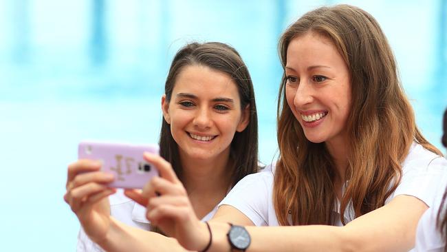 Tessa Lavey and Natalie Burton take a selfie during the Australian Women's Olympic Games basketball team announcement. Picture: Getty Images