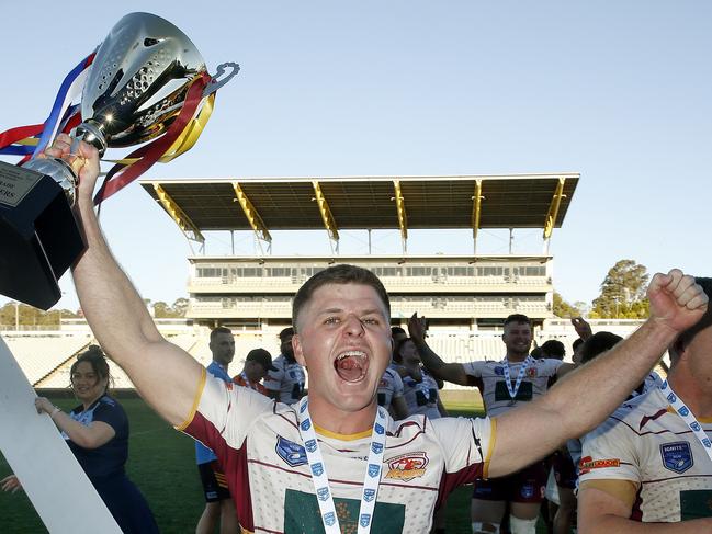 The man with the golden boot: Thirlmere’s Damon New enjoys the premiership celebrations. Picture: John Appleyard