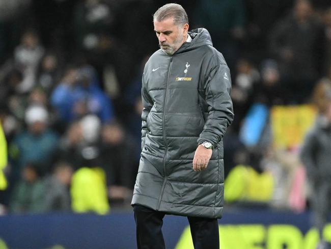 Tottenham Hotspur's Greek-Australian Head Coach Ange Postecoglou reacts to their defeat as he leaves after the English Premier League football match between Tottenham Hotspur and Liverpool at the Tottenham Hotspur Stadium in London, on December 22, 2024. Liverpool won the game 6-3. (Photo by Glyn KIRK / AFP) / RESTRICTED TO EDITORIAL USE. No use with unauthorized audio, video, data, fixture lists, club/league logos or 'live' services. Online in-match use limited to 120 images. An additional 40 images may be used in extra time. No video emulation. Social media in-match use limited to 120 images. An additional 40 images may be used in extra time. No use in betting publications, games or single club/league/player publications. /