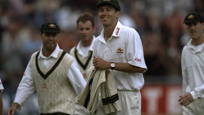 McGrath of Australia leads his side off the field after taking eight England wickets at Lord’s.