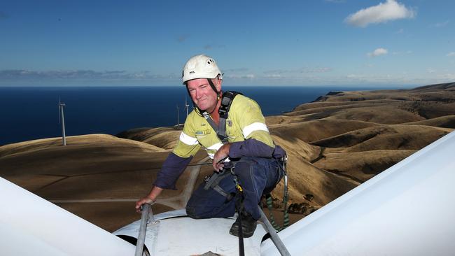 Providing renewable energy employs hundreds of South Australians, like Starfish Wind Farm technician Tony Richter at Cape Jervis. Picture: Simon Cross