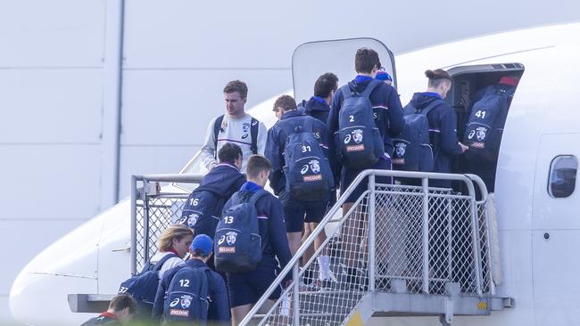 Bulldogs players leave Melbourne behind. Picture: Wayne Taylor