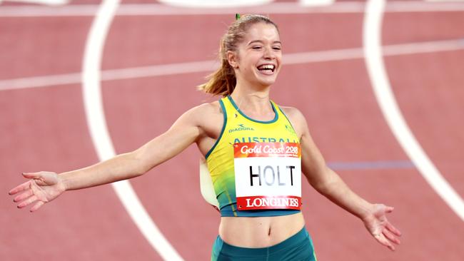 Isis Holt of Australia celebrates a gold medal win in the womens T35 100m on day seven of competition at Carrara Stadium on the Gold Coast, Australia, Wednesday, April 11, 2018. (AAP Image/Dean Lewins) NO ARCHIVING, EDITORIAL USE ONLY