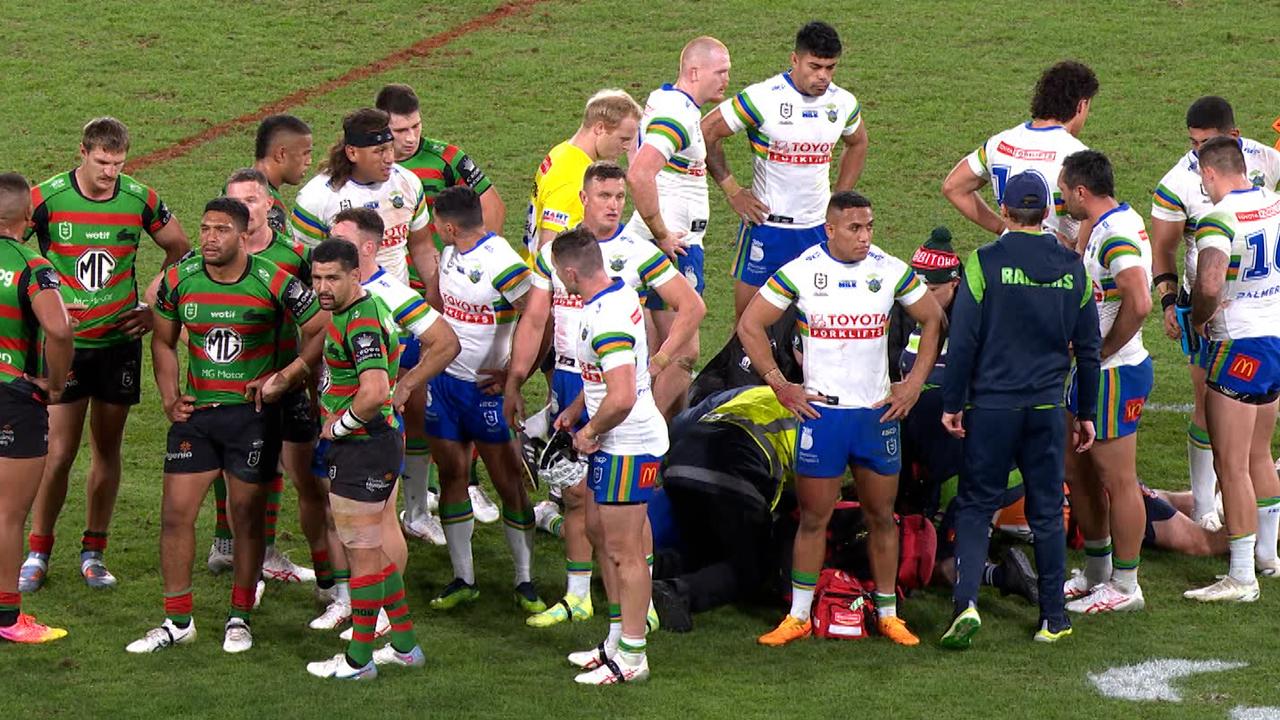 Corey Harawira-Naera is protected by the players.