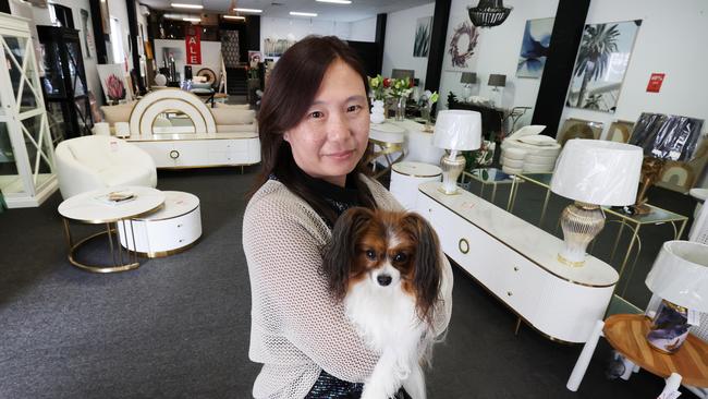 Found on Ferry is closing down after 12 years due to cash flow crisis. Owner Winnie Chin and her dog Lolly inside the store for one last sale where everything must go. Picture Glenn Hampson