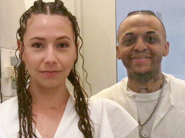 This photo from December 2024 courtesy of Helene Noa Dubois shows Steven Nelson, 37, and his wife, Helene Noa Dubois, standing on each side of a glass partition on their wedding day at the Allan B. Polunsky Unit, the prison that houses the 169 men on Texas' death row in Livingston, Texas. Nelson has spent more than a dozen years on Death Row in Texas and is to be executed by lethal injection on February 5, 2025, for the murder of a pastor that he insists he did not commit. "It's hard at times," the 37-year-old Nelson said in an interview with AFP at the maximum security prison in Livingston, a town 75 miles (120 kilometers) north of Houston, where he is awaiting his execution. "You're waiting to be put to death," he said. "So that kind of breaks a little part of you every day... You just don't want to do nothing." (Photo by Handout / FAMILY HANDOUT / AFP) / RESTRICTED TO EDITORIAL USE - MANDATORY CREDIT "AFP PHOTO / HANDOUT / HELENE NOA DUBOIS " - NO MARKETING NO ADVERTISING CAMPAIGNS - DISTRIBUTED AS A SERVICE TO CLIENTS / TO GO WITH AFP STORY by Cecile CLOCHERET and Francois PICARD, "'Breaks a little part of you every day': Texas man on Death Row"