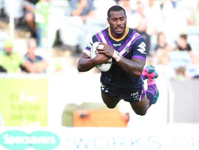 CANBERRA, AUSTRALIA - MARCH 22: Suliasi Vunivalu of the Storm flys through the air as he scores a try during the round two NRL match between the Canberra Raiders and the Melbourne Storm at GIO Stadium on March 22, 2019 in Canberra, Australia. (Photo by Tracey Nearmy/Getty Images)