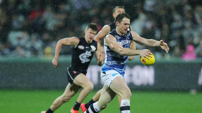 Patrick Dangerfield evades Sam Walsh. Picture: Michael Klein